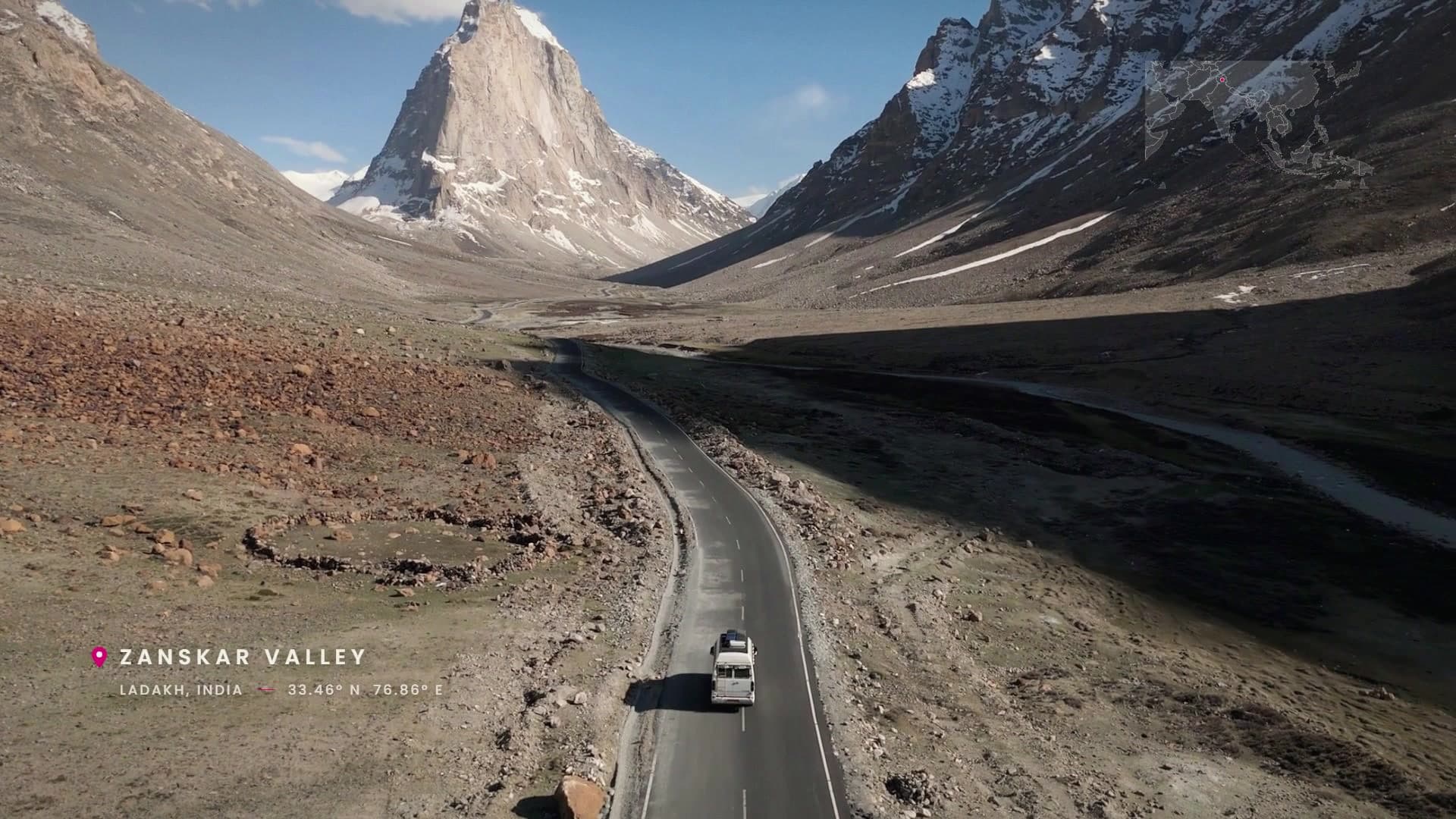 Aerial shot of a lone vehicle on the road through Zanskar Valley, Ladakh, from the TOALT brand film